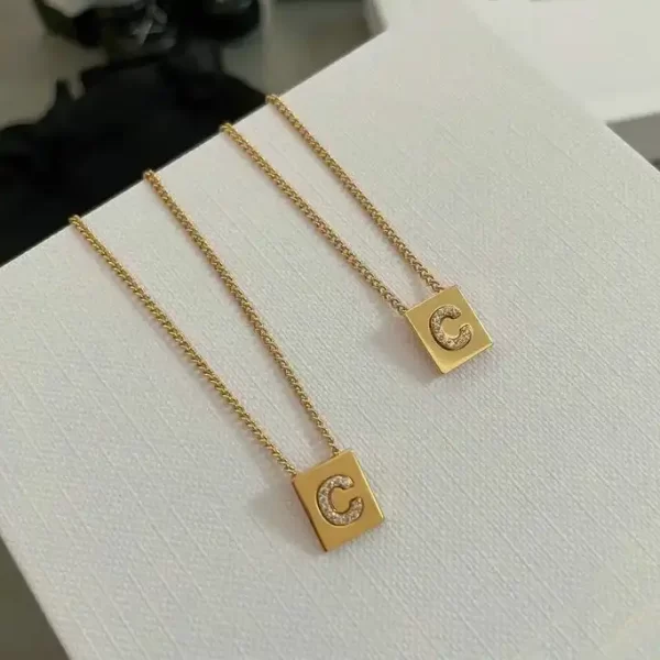 Celine Alphabet C Necklace In Brass With Gold Finish